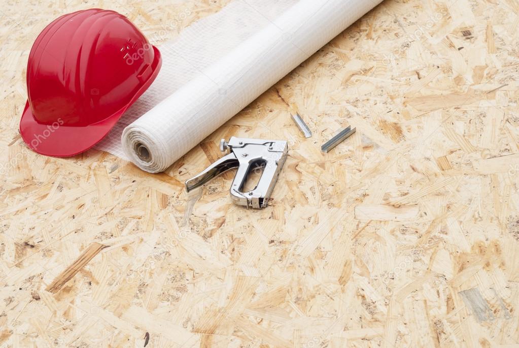 Vapor barrier and mounting a stapler Stock Photo by ©mkuchina 102920980