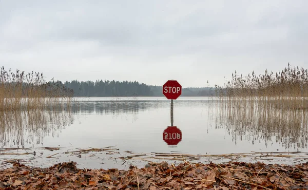 Red Stop Sign Lake Prohibits Entry Same Time Measures Water — Stock Photo, Image