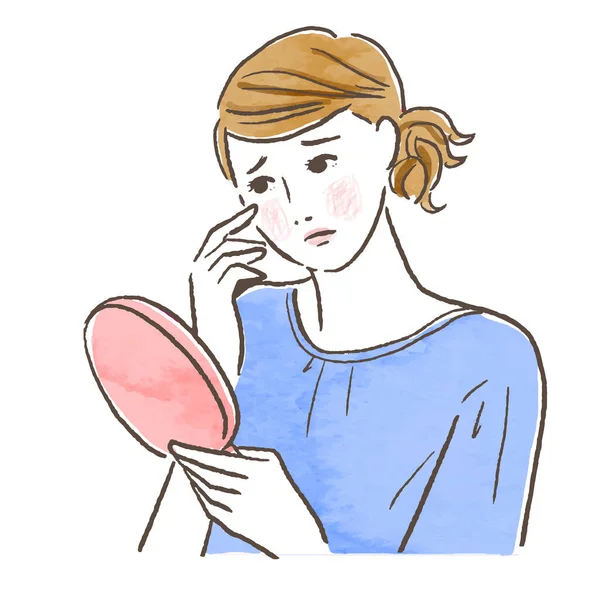 Aynaya bakan endişeli bir kadın.