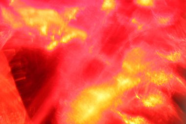 Çok renkli röflelerin soyut bulanık arkaplanı. kırmızı ve sarı bokeh seçici odak