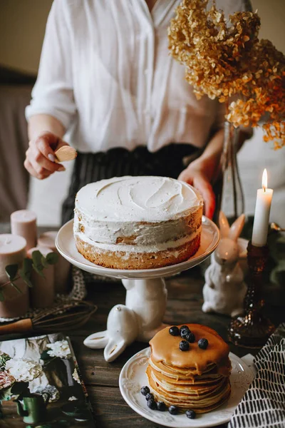 preparing a cake. preparing sweet desserts. bunny cake stand. white bunny. pancakes