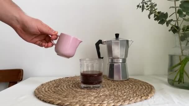 Hand Holds Pink Milk Jug Pours Milk Glass Coffee White — Stock Video
