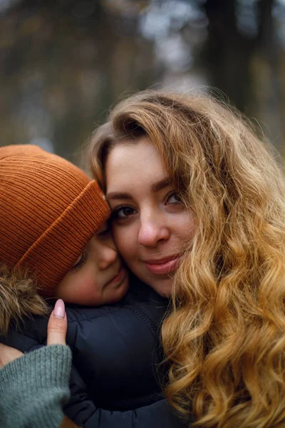 Portrait Young Woman Who Hugs Child Tightly Warm Clothing Young Stock Image