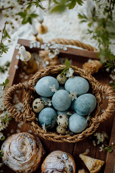 Orthodox Easter. Easter eggs and cakes top view. chicken eggs painted blue. chicken and quail eggs.