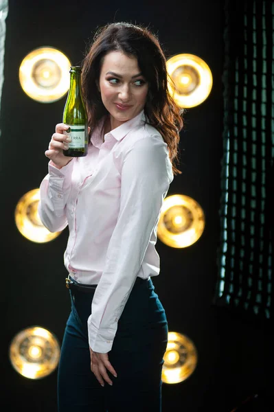 young beautiful woman with a cocktail in her hands