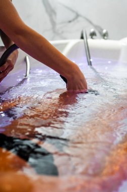 woman rolling a dough in kitchen
