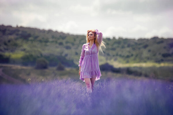 Blonde woman on the lavender field