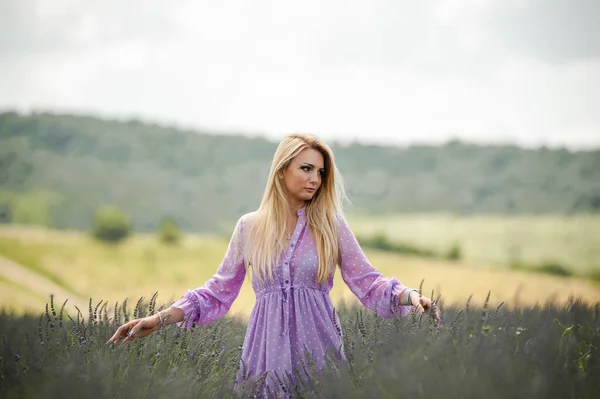 Blonde woman on the lavender field