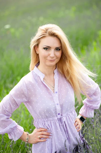 Blonde woman on the lavender field