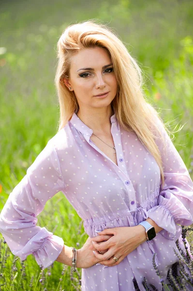 Blonde woman on the lavender field