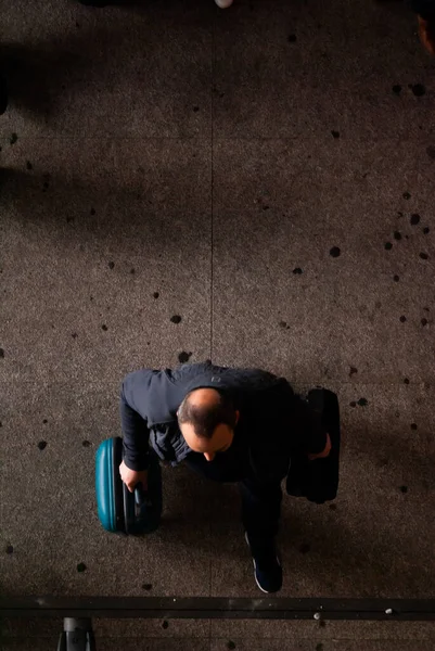aerial view, looking down at the airport. Man with luggage