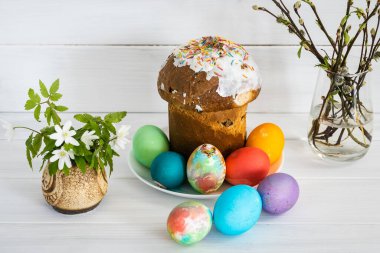 Easter cake set with colored eggs.