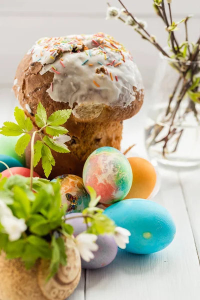 Easter cake set with colored eggs.