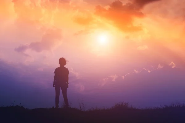 Silhouette of woman and sunset time Stock Picture