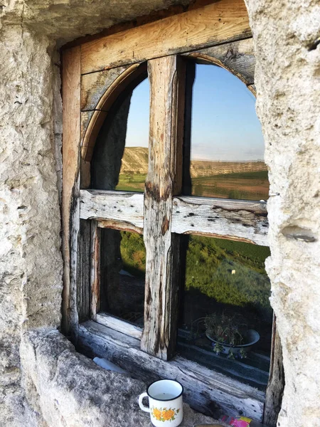 Old church\'s window inside the rock, Moldova