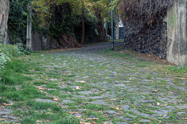 Ancient Sicilian road paved with volcanic stones
