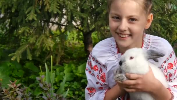 Girl and white rabbit — Stock Video