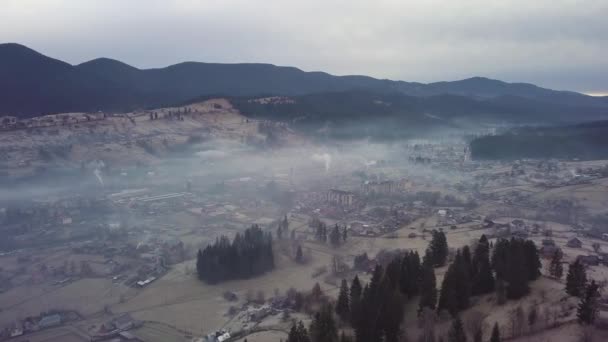 Flight over the village in the Carpathian Mountains