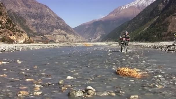 Crossing over the river on motorcycles — Stock Video