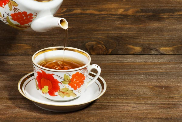 Cup of tea on a wooden background — Stock Photo, Image