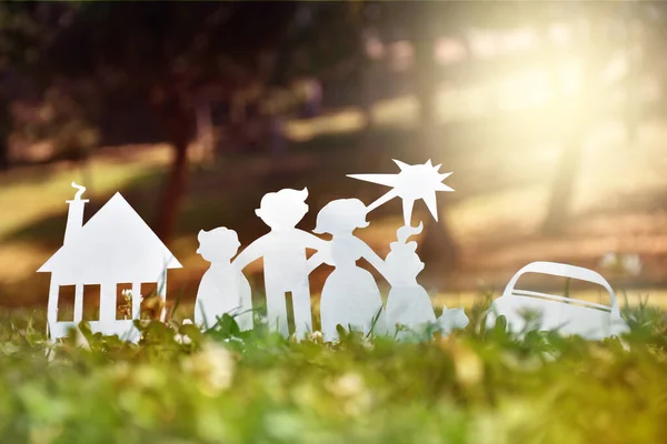 Paper family, house and car on a green grass. Family Life Insurance, protecting family, family  and love concepts. Concepts saving money for house or car. Mortgage and auto lending. Ecology concept.
