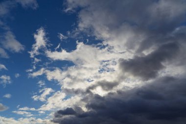 Layered clouds slowly cover the sky.