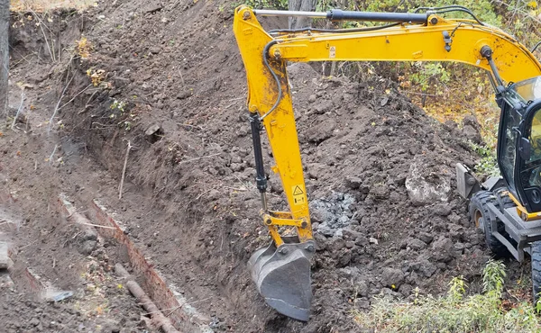 The process of earthmoving with construction machinery.