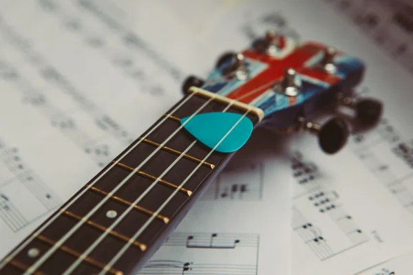 Ukulele and music notes sheet Stock Picture