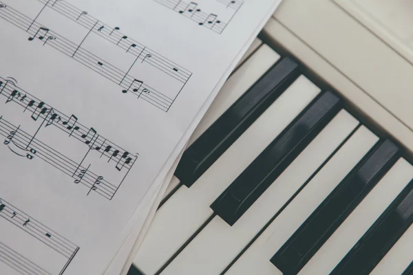 Music notes and piano keys Stock Image