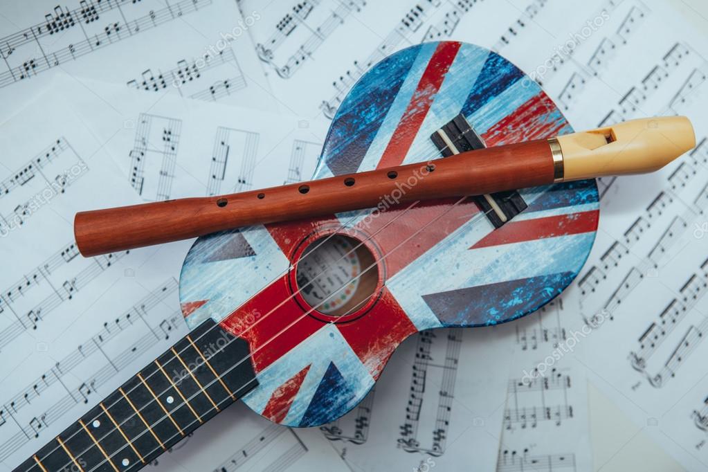 Recorder flute, Ukulele and music notes sheet — Stock Photo © mimiau