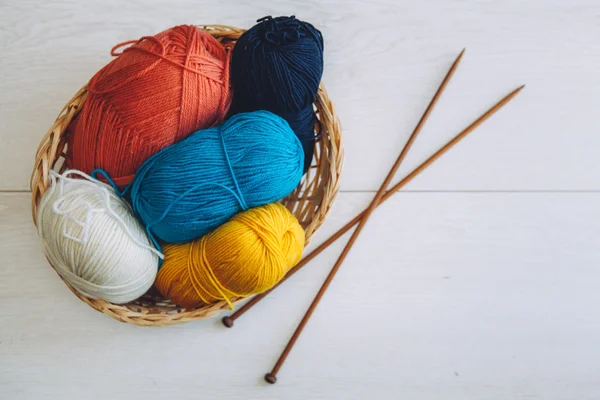 Colorful balls of yarn in the basket — Stock Photo, Image