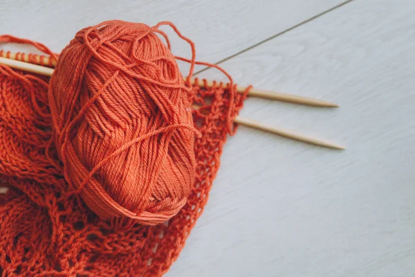 Red knitting wool and needles Royalty Free Stock Images