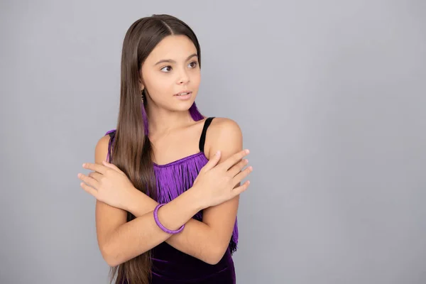 Tween girl wear elegant dress with fashion look keeping arms crossed grey background copy space, cool.