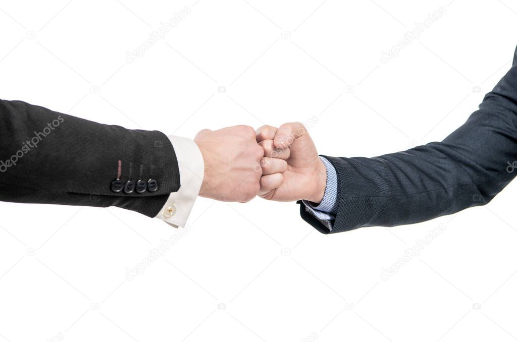 partner relationship. male friendship. businessmeeting. two pumping fist. business deal. partnership and cooperation. welcome gesture. support hands gesture of men after successful negotiations.