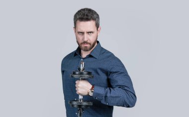 Güçlüdür. Patron güç ve otorite göster. Dambılı bir iş adamı. Spor gücü. Erkeklerin gücü. Başarılı bir sporcu. İş başarısı. Koltuk değnekleriyle eğitime hazır bir adam..