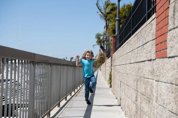Break free. Energetic child run on promenade. Happy boy enjoy free time. Having fun. Summer vacation