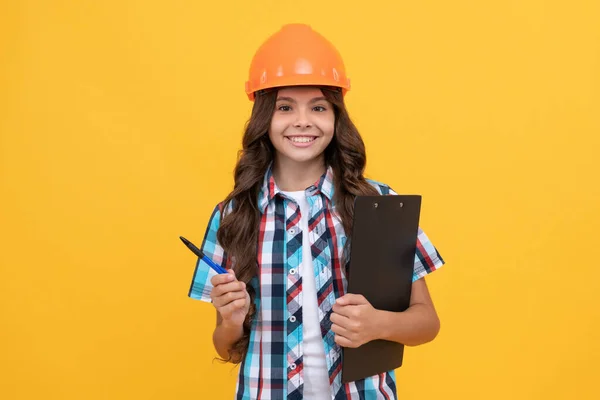 Child in helmet hold project. construction documents. signing a contract. kid education. — Stock Photo, Image