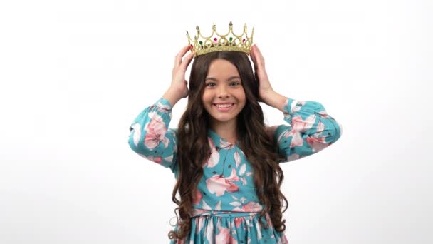 Happy egocentric child in queen crown pointing thumb up on herself, egoistic — Stockvideo