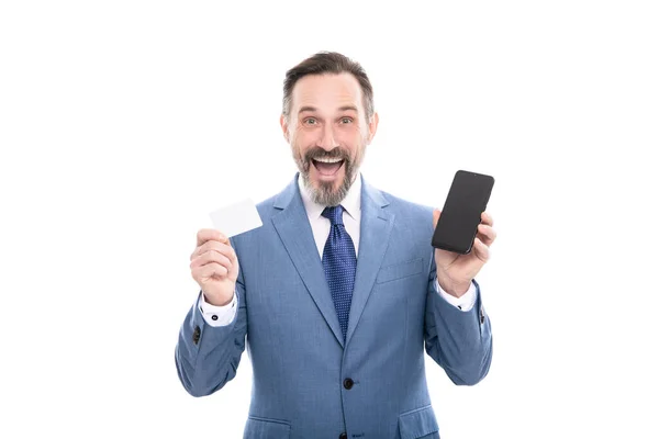 Surprised ceo hold card and cell phone for paying online isolated on white copy space, buy online. — Stok fotoğraf