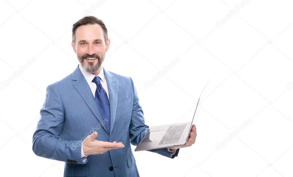 happy grizzled businessman presenting modern laptop work online isolated on white copy space, offer.