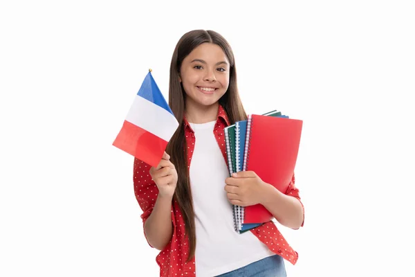 Ευτυχισμένη έφηβος κορίτσι κατέχουν γαλλική σημαία και το σχολικό βιβλίο για τις σπουδές, την εκπαίδευση στο εξωτερικό. — Φωτογραφία Αρχείου