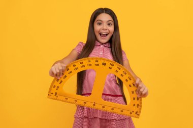 education for child. mathematics. amazed teen girl hold protractor ruler. back to school.