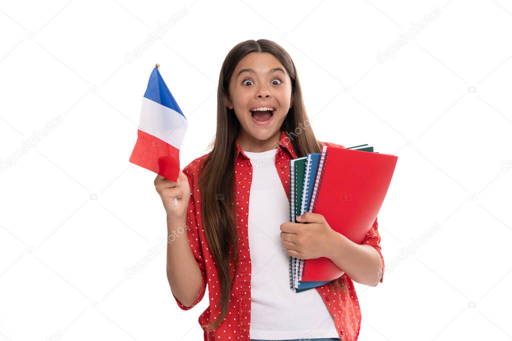 amazed kid hold french flag and school copybook for studying isolated on white, study abroad