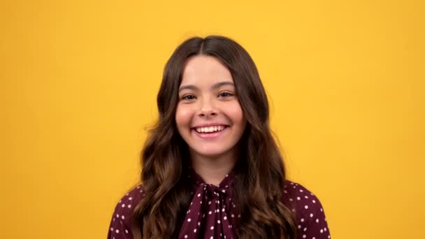 Happy child laughing on joke on yellow background, humor — Stock Video