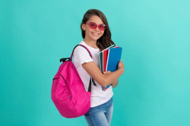happy child with backpack and copybook in sunglasses ready to study at school, school