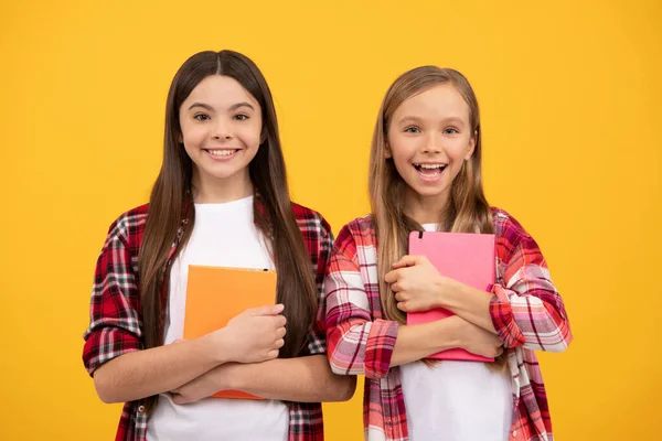 Cheerful kids going to do homework with books. smiling teenager student. education. — Stock Photo, Image