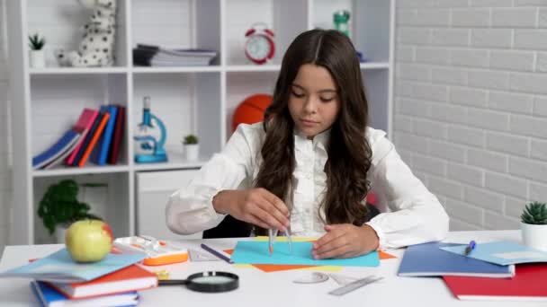 Busy kid in school uniform using geometry tools in classroom, trigonometry — ストック動画