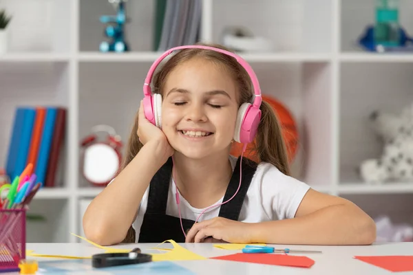 child in modern earphones. online education. back to school. happy teen girl in headphones.