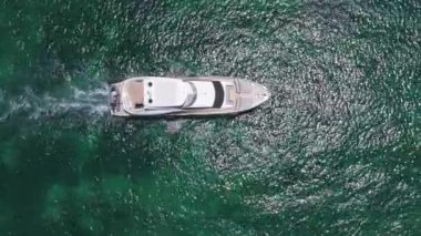 Vacation on summer. Yacht at sea. Motorboat yacht sailing at sea. Motorboat aerial top view. Luxury boat motor yacht at sea. Yachting boat tourism. Luxury lifestyle. Sailing yacht 4k footage.