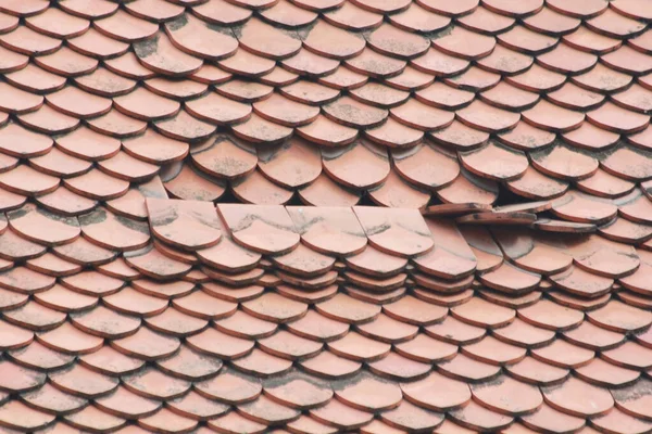 Old roof with red tiles in a Thai temple